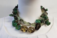 "This necklace will not disappoint. It is a one of a kind statement piece of jewelry, an investment. Made with beautiful Natural Green Turquoise, Smoky Quartz and Green Garnet also known as Prehnite and topped off with 925 Sterling Silver. This is a handmade piece and will not be duplicated. This piece is large. It adjusts from 17\" to 19\" long and is a lobster clasp with cone capped ends.  The faceted natural smoky quartz is polished and stunning. Runs in several sizes from small beads to larg Luxury Green Stone Necklaces, Artisan Green Jewelry With Unique Variations, Artisan Green Multi-stone Jewelry, Unique Multi-stone Green Jewelry, Unique Green Gemstone Beads, Luxury Green Necklaces With Natural Stones, Unique Green Multi-stone Jewelry, Unique Green Natural Stone Necklace, Unique Green Gemstones For Formal Occasions