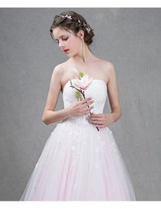 Feminine Ball-Gown Strapless Sweep Train Tulle Wedding Dress With Flowers Pink Strapless Dress With Fitted Bodice For Wedding, Strapless Wedding Dress For Prom Season, Pink Strapless Dress For Wedding Or Prom Season, Pink Strapless Tulle Gown, Pink Strapless Dress For Wedding, Strapless Ball Gown With Lace Bodice, Pink Lace Bodice Ball Gown For Wedding, Strapless Ball Gown With Sweep Train For Debutante Ball, Bridesmaid Wedding Dress With Sweep Train And Tulle Material