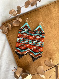 These tribal-style beaded earrings are made from selected Czech beads. Native seed bead earrings can be an excellent personalized gift for bridesmaids, Mothers Day, Birthdays, Valentine's Day, Wedding day, Christmas, New Year, and for your loved ones. ♡ Length - 4.5'' (11.5 Centimeters) ♡ Width - 1.2'' (3.5 Centimeters) ♡ Quality Czech beads ♡ Stainless steel hooks/925 Silver hooks I accept payments through Paypal. More tribal earrings are available in my Etsy shop: https://www.etsy.com/listing/ Southwestern Style Beaded Earrings, Southwestern Style Beaded Earrings With Ear Wire As Gift, Southwestern Dangle Beaded Earrings As Gift, Artisan Beaded Earrings With Round Beads For Festivals, Southwestern Dangle Beaded Earrings For Gifts, Artisan Beaded Earrings With Dangling Beads For Festival, Southwestern Beaded Fringe Earrings For Gift, Artisan Colorful Beaded Earrings For Festivals, Bohemian Beaded Earrings With Fringe