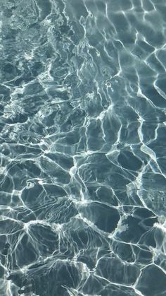 the water is very clear and blue with some ripples on it's surface