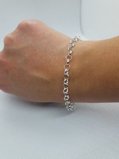 This beautiful delicated bracelet has been carefully crafted in solid 925 sterling silver. Great for any ocassion! Buy it for your-self or for someone you love . Bracelet can also be resized at no extra cost and it will be shipped to you in an elegant gift box. A tracking shipping number will be provided to you once the bracelet has been mailed. Bracelet length: 8 inches Weight: 5.1 grams Materials: 925 Solid Sterling Silver, also available in 10k Yellow Gold Lobster claw Thanks for visiting my Sterling Silver Link Bracelet For Anniversary, Everyday Silver Bracelet With Rolo Chain, Classic Silver Bracelets With Rolo Chain, Classic Silver Bracelet With Rolo Chain, Silver Rolo Chain Bracelet For Everyday, Dainty Silver Gold Jubilee Bracelet, Sterling Silver Link Bracelets With Rolo Chain, Minimalist Sterling Silver Hallmarked Bracelet As Gift, White Gold Link Bracelets As Gift