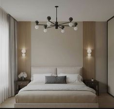 a large bed sitting under a chandelier next to two lamps in a bedroom