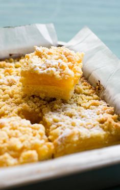 two pieces of cake sitting on top of each other in a baking pan with paper