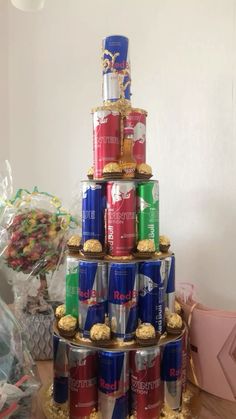 a stack of cans stacked on top of each other with candy in the bottom one