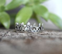 "Sterling Silver Crown ring: - .925 solid sterling silver. - 6mm height, 1.2mm thickness. -US sizes 4-10.5 with half sizes Crown Princess Stacking Set: https://www.etsy.com/listing/172483980/silver-crown-ring-stacking-set-sterling?ref=shop_home_active 💜Check out our new \"Ready to Ship\" section for gifts that ship in 1 business day. https://www.etsy.com/shop/AWildViolet?ref=seller-platform-mcnav§ion_id=23587515 Connect with us on Instagram @a_wild_violet for sales and giveaways! **All items ar Sterling Silver Ring With Crown Design For Promise, Classic Silver Crown Rings, Sterling Silver Crown Ring, Sterling Silver Crown Design Ring, Sterling Silver Crown-shaped Ring, Crown Ring Princess, Midi Rings Silver, Princess Closet, Silver Crown Ring