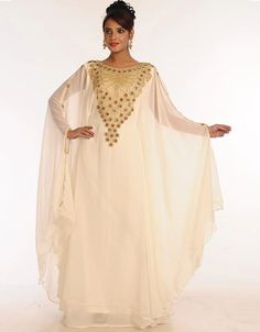 ❤️Inshallah❤️ Trendy Off White Georgette Hand Embroidery Party Wear Kaftan 👗 Order Online latest Embroidered Kaftan which are made up from best quality fabrics with latest styles from our large collections at arabicattire.com Shop Now : https://bit.ly/3Q59Xdo Buy online @ $71.5 #eveningkaftans #arabicapparel #middleeasternclothingonline #islamickaftan #fittedkaftandresses #longkaftandressesonline #dressykaftans #islamicclothingforsale #middleeastclothingforwomen Middle East Clothing, Kids Kaftan, Modest Evening Dress, Zari Embroidery, Long Kaftan, Georgette Dress, Hooded Dress, Islamic Clothing, Zari Work