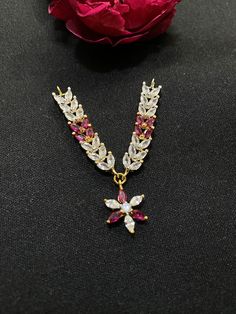 Polish 22k yellow gold plating  Stone simulated  White Cubic zirconia & ruby These are hand setting work ( Hand made with love for our laddu Gopal ji) Made by Ray fineornates Jewellery from India - for your every type of occasion and mood ✔ HIGH QUALITY~ We make everything by hand and pay extra attention to high-quality materials. Our products are all sanitised.   ✔ Dazzling~ Our handmade product bring you the superior feeling in every occasion, in the office or in the evening to go out, the min Gold Plated Pendant Jewelry For Puja, Gold Plated Pendant For Puja, Bollywood Style Yellow Gold Temple Necklace Gift, Festive American Diamond Necklace As A Gift, Festive American Diamond Necklace As Gift, Festive American Diamond Necklaces For Gifts, Festive American Diamond Necklace Gift, Hand Set Yellow Gold Jewelry For Puja, Gold Plated Jewelry For Puja And Festivals