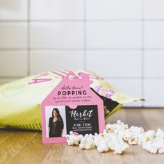 a bag of popcorn sitting on top of a wooden table