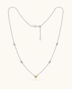 Introducing Paloma's iconic Heart necklace, a unique design that beautifully spotlights a fancy yellow diamond perfectly paired with a glistening white diamond, forming a flawless heart motif. The chain is adorned with diamonds by the yard, creating a radiant sparkle from every angle. Luxury Yellow Necklaces For Anniversary, Diamond Heart Pendant Necklace With Delicate Chain, Yellow Diamond Jewelry With Single Cut Diamonds, Yellow Diamond Necklace For Anniversary, Elegant Yellow Necklace With Delicate Chain, Formal Yellow Diamond Necklace, Yellow Diamond Fine Jewelry Necklace, Fine Jewelry Yellow Diamond Necklace, Yellow Diamond-cut Necklace In Fine Jewelry Style