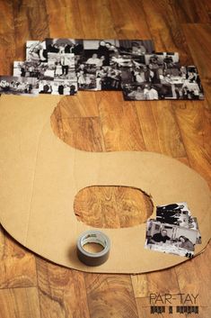 a piece of cardboard sitting on top of a wooden floor