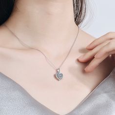 Delicate and elegant, this heart necklace will add a touch of sophistication to any wedding gown or formal ensemble. Adorned with heart-shaped cubic zirconia that captures the light from every angle with a perfectly translucent appeal, the necklace is rhodium / rose gold plated for a flawless finish which perfectly enhances the intricate detailing and conveys a modern take on old elegance. Length: 16" (approx. 40.6cm) with a 2" (approx. 5cm) extension for comfortable sizing. Available in Silver Sparkling Wedding, Anniversary Necklace, Sparkle Wedding, Wedding Party Jewelry, Moissanite Jewelry, Charm Pendant Necklace, Necklace Dainty, Diamond Pendant Necklace, Bridal Necklace