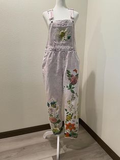 Upcycled preowned Universal Thread brand overalls pink denim light washed with floral cotton print appliqué. size 8 inseam 29 Casual Floral Print Overalls For Spring, Spring Floral Print Overalls, Floral Print Spring Overalls, Relaxed Fit Overalls For Spring, Casual Upcycled Bottoms For Spring, Pink Cotton Bib Front Overalls, Cotton Overalls For Spring, Cotton Spring Overalls, Pink Relaxed Fit Cotton Overalls