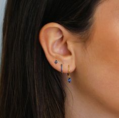 ✦ 𝐈𝐭𝐞𝐦 𝐃𝐞𝐬𝐜𝐫𝐢𝐩𝐭𝐢𝐨𝐧 "Discover elegance with our Sapphire Earring Set by Pashicreations. Featuring Dangling Earrings, Hoop Earrings, and Stud Earrings, each piece is crafted to elevate any occasion. Ideal as Blue Birthstone Jewelry and an Anniversary or Birthday Gift, our collection offers timeless sophistication for everyday wear. Explore minimalist jewelry, perfect for her." ✦ Product Details:- Material: Sterling Silver Finish: 14k Gold Plated Featuring a Set of 3 CZ Sapphire Earr Gold And Sapphire Earrings, Blue Earring Stack, Sapphire Earring, Blue Sapphire Earrings, Sapphire Earrings Studs, Sapphire Studs, Dangle Hoop Earrings, Prom Jewelry, Jewelry Birthday