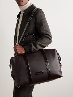 TOM FORD's holdall is constructed from a combination of pebble-grain and smooth leather that'll last through years of travel. Suitable for long weekends or overnight work trips, it's sized to fit two changes of clothes, plus your wash bag and laptop. The detachable shoulder strap allows you to go hands-free. Luxury Briefcase For Overnight Trips, Luxury Leather Duffle Bag For Work, Luxury Workwear Duffle Bag, Classic Leather Weekender Bag For Work, Saffiano Leather Travel Bags With Leather Trim, Travel Bags With Saffiano Leather And Leather Trim, Leather Holdall, Ford Accessories, Summer Sunglasses