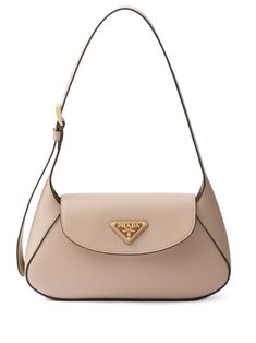 light beige leather enamel triangle logo adjustable shoulder strap foldover top with magnetic fastening main compartment gold-tone hardware internal logo stamp Unique Designer Bags, Cute Kate Spade Bags, Designer Handbags Aesthetic, Polene Bags, Brown Designer Bag, Trendy Designer Bags, Old Money Bags, White Bag Outfit, Tas Prada