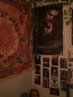 a room with posters and pictures on the wall, including twilight dawn - breaking dawn