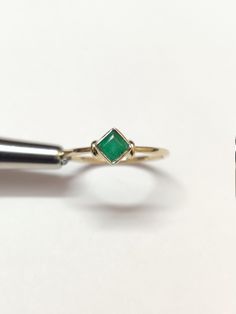 18K Gold Emerald Dainty Ring Solid Gold Emerald Ring 4 mm Square Emerald Ring Hallmarked 18K Gold Stacking Ring Natural Emerald Ring Men Metal : Yellow Gold Metal Carat : 18K Gemstone : Natural Emerald Stone Weight : 0.35 Ct Weight (US 5-US 18) : 1.5 gm - 2 gm approx. Ring Size: US 5-US 18 ✱Custom Order We love to accept Custom Order so feel free to throw us anything ✱Note : 1). Don't find your ring size or gemstone feel free to message me 2). Need this ring in another metal silver , white gold Heirloom Gold Emerald Stackable Ring, Gold Stackable Diamond Ring, Gold Stackable Emerald Ring For Formal Occasions, Heirloom Stackable Emerald Ring In Yellow Gold, Heirloom Yellow Gold Stackable Emerald Ring, Princess Cut Yellow Gold Rings For May Birthstone, Yellow Gold Princess Cut Rings For May Birthstone, Gold Rings With Diamond Cut For May Birthstone, Gold Diamond Cut Rings For May Birthstone