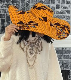 African print hat features a wide range of authentic African prints, each bursting with rich, bold colors and intricate patterns that reflect the diverse tapestry of African cultures. The design of the hat is modern and stylish, with a classic shape that suits various face shapes and hairstyles. African print hat is crafted from high-quality Original African patterns 100% cotton One size fits for all Especially great for all-season outings Modern and stylish design It's versatile same print inside and outside It's the perfect look for your summer vacation, weekend getaway, beach or pool party, or for a trip to the Islands. It's unisex, making it a fantastic choice for anyone who wants to celebrate African fashion. Womens Beach Hat, African Prints, African Pattern, African Culture, Beach Hat, Bucket Hats, Woman Beach, Weekend Getaway, Intricate Patterns