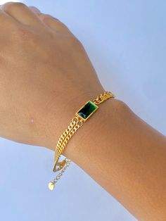 Classy with a touch of emerald. This bracelet is perfect for the season giving you a subtle pop of color in your stack. Wear this alone or stack with others! The bracelet is made of stainless steel, so waterproof! The color remains perfect. Gold: 18k gold platingMaterial: Stainless steelLength: 17cm + 5cm Waterproof Tarnish Free Hypoallergenic Glazd Pouch with every order Free US shipping Easy Exchange & Return policy PRODUCT INFOAll our jewelry are made of stainless steel material. For the gold Emerald Chain, Emerald Bracelet, Gold Piece, Stainless Steel Material, Delicate Bracelet, Chain Bracelet, Gold Jewelry, Color Pop, Emerald