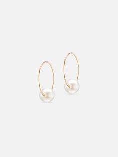 A delicate take on the essential pearl earring. These hoops feature one floating pearl with modern elegance. 14k yellow gold Pearl Made in New York Minimalist Hoop Pearl Earrings For Formal Occasions, Minimalist Yellow Gold Pearl Earrings, Modern Small Hoop Earrings With Pearl Drop, Yellow Gold Hoop Earrings With Pearl Pendant, Minimalist Formal Hoop Earrings With Pearl Drop, Formal Minimalist Hoop Pearl Earrings, Minimalist Yellow Gold Pearl Earrings With Charm, Formal Minimalist Hoop Earrings With Pearl Drop, Modern Small Hoop Pearl Drop Earrings