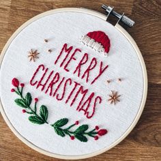 a cross stitch christmas ornament with the words merry christmas on it