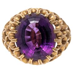 14k yellow gold ring. This wonderful ring has an oval faceted, medium to dark purple color amethyst, approximately 6.84 CTS and set into a wide, concentric open scalloped motif mounting. Marks: 14k Dimensions: 7/16" across the top x 9/16" long Weight: 5.7 gross dwt Amethyst Cocktail Ring, Amethyst Ring Vintage, Amethyst Set, Green Amethyst Ring, Vintage Cocktail Ring, Cocktail Jewelry, Ring Crafts, Lorde, Royal Purple