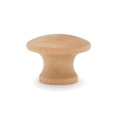 an unfinished wooden knob on a white background