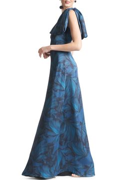 Elegant blooms wash over a serene gown designed in a one-shoulder silhouette and certain to turn every head. 60" length (Size 8) One-shoulder neck Lined 100% polyester Dry clean Imported Asian Owned/Founded Tie Neck Dress, Halter Gown, Elegant Maxi Dress, Timeless Dress, Special Occasion Outfits, Fall Skirts, Bride Dresses, Formal Gowns, Mother Of The Bride Dresses