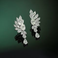 Whenever I visit Amsterdam, the first place I go to is the beautiful and timeless flower markets. I am immediately calmed by the striking display of flowers, bountiful and bursting with life. This is the feeling that I wanted to capture in the design of the Amsterdam Earrings. Delicately crafted with a combination of marquise, oval, and pear diamonds the diamond petals create a stunning structured edge, highlighting the grace and beauty only the Amsterdam Earrings can capture. Luxury Pear-shaped Cluster Earrings For Formal Occasions, Luxury Pear-shaped Cluster Earrings For Formal Events, Luxury Marquise Diamond Earrings, Luxury Flower Shaped Diamond Earrings, Luxury Marquise Brilliant Cut Bridal Earrings, Luxury Marquise Formal Earrings, Luxury Bridal Marquise Earrings With Brilliant Cut, Luxury Bridal Earrings Marquise With Brilliant Cut, Elegant Platinum Cluster Earrings As Gift