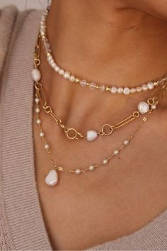 Elevate your style with our Beaded Pearl Necklace, a perfect blend of timeless elegance and sophistication. This exquisite necklace features a string of lustrous pearls delicately interspersed with sparkling beads, creating a stunning and luxurious look. The classic combination of pearls and beads adds a touch of glamour to any outfit, making it a versatile accessory for both formal occasions and everyday wear. Elegant Multi-strand Pearl Necklace, Chic Pearl White Jewelry With Pearl Chain, Elegant Multi-strand Necklace With Pearl Pendant, Everyday Beaded Pearl Necklace, Elegant Multi-strand Pearl Drop Jewelry, Chic Pearl-embellished Pearl White Jewelry, Feminine Gold Round Beaded Jewelry, Feminine Gold Jewelry With Round Beads, Chic Pearl White Choker Jewelry