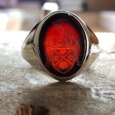 Made to order - 925 sterling silver or 10K - 14K - 18K Solid Gold, signet ring engraved with your university's logo, family crest or any image you request. There is no extra cost for side engravings. ✔Ring Details Ring stone 16mm Metal: 10K Gold, 14K, 18K Gold or 925 Sterling SILVER Please send us a sample image you would like engraved after placing an order. ✈️ Shipping Policy FREE EXPRESS SHIPPING to USA and EU. We use Fedex, TNT, UPS for express shipping. For shipping services, you will be provided with a tracking number. ➡️After the full payment is received, the product will be shipped within 5-7 business days. Fast shipping is delivered within approximately 1-4 business days. 📯 Import duties, taxes and charges are not included in the item price or shipping charges. Customs or charges Heirloom Red Signet Ring With Polished Finish, Classic Carnelian Signet Ring For Formal Events, Classic Carnelian Signet Ring For Formal Occasions, Red Engraved Signet Ring For Formal Occasion, Formal Red Engraved Signet Ring, Classic Red Intaglio Jewelry, Classic Carnelian Signet Ring For Anniversary, Classic Carnelian Signet Ring With Polished Finish, Sterling Silver Signet Ring With Polished Oval Cabochon