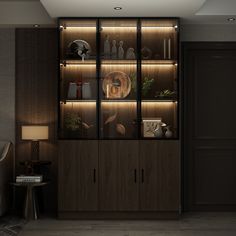 a room with some lights on the wall and shelves in front of it, filled with vases