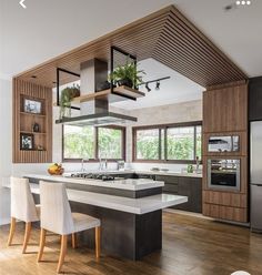 a large kitchen with an island in the middle