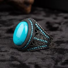 Turquoise Silver Men Ring with Micro Turquoise Stones. Handmade in 925 sterling silver with turquoise stone. Turquoise - Feroza stone settled on the ring and covered with small Turquoise stones. The dimensions of the stone are 18 mm x 13 mm. The average weight of Turquoise Silver Men Ring with Micro Turquoise Stones is 16 gr. (depends on your ring size). Classic and exclusive style. Stone Type: Turquoise - Feroza Stone Color: Blue Stone Dimensions: 18 mm x 13 mm Average Weight: 16 gr. (depends o Feroza Stone, Silver For Men, Silver Men Ring, Silver Handmade Jewelry, Men Ring, Average Weight, Turquoise Stones, Blue Band, Silver Man