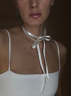 La Blanche 🤍 🦪 Natural Seashell Pearl Necklace collar with long satin ribbon ties. Shampagne White Color. High quality, hand-sewed on satin and natural seashell pearls. Comes in white pouch bag adorned with pearls. White Necklace is perfect for bride hen party, dinner blanche and many other celebrations. Bridal necklace inspired by victorian era. Bridesmaids gift idea for bride. #PearlChoker #BrideNecklace #UniqueJewelry Luxury Ribbon Jewelry For Parties, Knotted Ribbon Necklace, Cheap White Statement Necklace, Pearl Tie Shaped Necklace, Luxury White Necklaces With Latkans, Handmade White Necklaces, Pearl Rope, Multi Strand Pearl Necklace, Natural Pearl Necklace