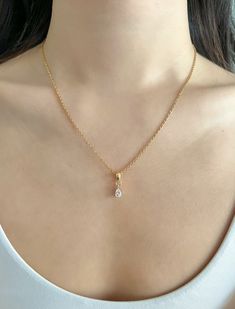 Our dainty link chain necklaces are made of stainless steel and plated with 18k gold. Not only is stainless steel hypoallergenic, but it's also highly durable, water-resistant, and tarnish-resistant! DETAILS ------------ - 18k Gold Plated Stainless Steel Chain, Lobster Clasp, 17in + 2in extender - Pendant: 18k Gold Plated, Cubic Zirconia, 8.5 x 5.5 x 3.5mm - Polishing cloth and vegan leather button pouch included PACKAGING & GIFTING -------------------------------- - All Stone & Sonder pieces co Trending Chains For Women, Teardrop Pendant Necklace, Classic Drop Necklace For Anniversary, Elegant Pear-shaped Drop Necklace Gift, Teardrop Gold Plated Necklace For Wedding, Gold Plated Teardrop Necklace For Wedding, Dainty Pear-shaped Necklace For Formal Occasions, Hypoallergenic Gold Plated Jewelry For Wedding, Dainty Pear-shaped Drop Necklace For Formal Events