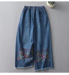 SPECIFICATIONS 2023 Summer New Design Vintage Ethnic Style Jeans Floral Embroidery Loose Casual Wide Leg Denim Pants High Waist Blue Trousers Brand Name: LFFMHMT Material: COTTON Material: Polyester Elasticity: Medium Strecth Fabric Type: Softener Length: Ankle-Length Pants Fit Type: LOOSE Style: vintage Decoration: Patchwork Origin: Mainland China CN: Guangdong Season: Spring/Summer Jeans Style: Wide Leg Pants Age: JUNIOR Waist Type: HIGH Model Number: 230727C Release Date: Summer 2023 Thicknes Embroidered Wide Leg Denim Blue Pants, Casual Embroidered Blue Pants, Non-stretch Denim Blue Bottoms With Floral Embroidery, Blue Embroidered Wide Leg Jeans, Blue Embroidered Spring Pants, Baggy Embroidered Denim Blue Bottoms, Embroidered Baggy Denim Blue Bottoms, Blue Baggy Embroidered Bottoms, Blue Embroidered Straight Leg Bottoms