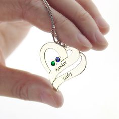 Our Two Hearts Forever One Necklace features beautiful birthstones and personalized engravings of each person. Meticulously handcrafted from .925 Sterling Silver and your choice of plating option: 18K Gold. An excellent gift choice for the one you love. Personalized Heart Cut Jewelry For Gifts, Heart Cut Birthstone Necklace For Anniversary, Silver Nameplate Necklaces With Birthstone, Sterling Silver Heart Cut Birthstone Necklace For Gift, Customizable Double Heart Jewelry Gift, Heart Cut Name Jewelry For Gift, Customizable Heart Jewelry For Anniversary, Sterling Silver Birthstone Necklace For Valentine's Day, Sterling Silver Birthstone Necklace With Custom Name For Mom