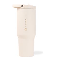 the tumbler cup is white and has a handle on it's side, with an insulated lid