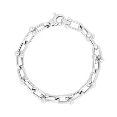 With a sleek and unique design, this silver link chain bracelet instantly elevates your attire. Hollow sterling silver Oval-shaped interlocking links with polished bead accents 9.2mm-wide chain 8.0 inches; lobster claw clasp Elegant Silver Chain Link Paperclip Bracelet, Everyday White Gold Chain Link Bracelet, Modern Bracelets With Solid Chain Link Construction, Modern Solid Link Chain Bracelet, Elegant Silver Paperclip Chain Bracelet, Modern Solid Chain Link Bracelet, Silver Paperclip Bracelet With Rectangular Links For Formal Occasions, White Gold Cable Chain Link Bracelet, White Gold Link Bracelet With Cable Chain