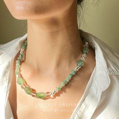 *Handcrafted: Each piece is meticulously handmade, ensuring a personal touch in every necklace. *Natural Stones: Utilizes genuine green agate stones, promising natural beauty and uniqueness. *Size: Features a 18-inch length with a 5cm extension chain for adjustable fitting. *Designer Piece: Exclusively designed by me, showcasing a blend of creativity and craftsmanship. | Key Highlights of the "Verdant Enchantment" Necklace | *Unique Craftsmanship: Every necklace is a testament to individual craftsmanship, with a dynamic spectrum of green from light to deep hues, reminiscent of nature's balance and serenity. *Material: Vibrant green agate beads paired with sparkling, transparent crystal beads, offering an elegant and refreshing look. *Versatility: Ideal for both daily wear and special occas Handmade Bohemian Green Emerald Necklace, Handmade Green Bohemian Emerald Necklace, Green Moss Agate Round Bead Necklaces, Handmade Moss Agate Round Beads Necklace, Handmade Adjustable Green Emerald Necklace, Green Moss Agate Round Bead Necklace, Unique Green Crystal Necklaces With Gemstones, Unique Green Crystal Necklace With Gemstone, Unique Green Crystal Gemstone Necklace