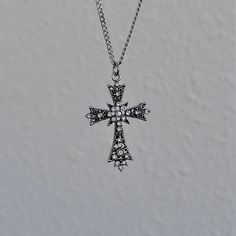 This silver gothic cross necklace boasts a vintage celtic pendant design, making it the perfect minimalist religious jewelry gift idea for your Catholic friend who appreciates grunge-inspired accessories. 𝐃𝐄𝐓𝐀𝐈𝐋𝐒:  ⭐️ Necklace lengths available 14" 16" 18" 20" ⭐️ Cross pendant size is 1 1/2" ⭐️ The silver cross charm is silver plated over alloy. The chain necklace is up on stainless steel, safe for sensitive skin ⭐️ The best statement piece, The Enlightend cross necklace  ⭐️ ALL jewelry i Gothic Cross Necklace, Grunge Jewelry, Gothic Cross, Celtic Pendant, Gothic Crosses, Celtic Cross, Cross Charms, Religious Jewelry, Pendant Design