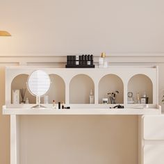 a white counter topped with lots of cosmetics and personal care items on top of it