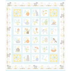 a baby quilt with animals and letters on it