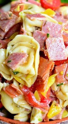 pasta salad with ham and peppers in a bowl