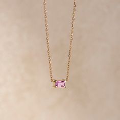 A simple solitaire pink sapphire necklace 14K gold for women. The stone is natural genuine sapphire in octagon-emerald cut. This dainty necklace is a great Valentines Day gift for her. ● Metal: 14Κ Gold ● Stone: Sapphire ● Weight: 0.37ct ● Stone's dimensions: 5mm x 3mm ● Cut: Octagon Cut ● Necklace length: 40cm G I F T S All our pieces are delivered beautifully packaged and gift ready with a certificate of authenticity for the metal and the stone. P R O D U C T I O N ∙ T I M E * S H I P P I N G * P O L I C I E S Please keep in mind that each item is handcrafted, and we need 5 days at least for its production. If you need your order on a specific date, please contact us. All orders are shipped worldwide via FedEx Express for speed and security. The estimated delivery time is 3 days to the U Rose Gold Jewelry With Pink Sapphire Gemstone, Fine Jewelry With Pink Sapphire In Prong Setting, Pink Gemstone Necklace In 14k Gold, Fine Jewelry Pink Sapphire With Prong Setting, Fine Jewelry In Yellow Gold With Pink Sapphire, Pink Oval 14k Gold Necklace, Rose Gold Pink Sapphire Necklaces Gift, Rose Gold Pink Sapphire Necklace For Gift, Yellow Gold Pink Sapphire Fine Jewelry