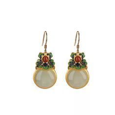 Material: S925 Sterling Silver with Gold PlatingGemstones: Hetian Jade (approximately 14mm), Red Agate (approximately 4mm)Weight: Approximately 9gSize: Total Length: 40mm, Width: 15mm Description:These Jade Blossom Drop Earrings are a stunning blend of elegance and vibrancy, featuring a round Hetian jade centerpiece complemented by a delicate red agate accent. The jade, with its soft green hue and 14mm diameter, brings a serene and sophisticated touch, while the vivid red agate adds a pop of color. Intricate enamel detailing in a floral motif completes the design, set in gold-plated S925 sterling silver. With a total length of 40mm, these earrings sway gracefully, making them perfect for adding a unique, artistic flair to any outfit. Note: Due to the natural characteristics of jade and aga Hetian Jade, Pearl Jewelry Necklace, Natural Stones Necklace, Gold Statement Earrings, Natural Stone Jewelry, Natural Stone Bracelets, Red Agate, Anklet Jewelry, Design Set