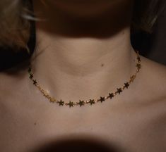 Simple & sweet star choker. One size fits all. About 12.5in-16in adjustable. If you are concerned with the size feel free to leave your measurements when you check out. Necklace is made of gold plated copper. Water, lotion, fragrances, sweat (any kind of moisture) can cause discoloration. Shipped with minimal packaging to avoid unnecessary waste. ♥️🌎 Check out our hanging stars choker here: https://etsy.me/2HiGzhi Check out our star gemstone here: https://etsy.me/31pUk68 Check out out our s Adjustable Dainty Star Jewelry, Trendy Star Charm Choker, Trendy Adjustable Jewelry With Star Charm, Trendy Adjustable Star-shaped Necklace, Trendy Adjustable Star Necklaces, Adjustable Star Choker, Star Print Jewelry As A Gift, Trendy Star Charm Choker As Gift, Trendy Choker With Star Charm For Gift