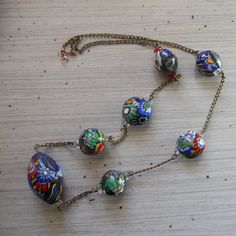 Hey, I found this really awesome Etsy listing at https://www.etsy.com/listing/210030724/vintage-murano-millefiori-beaded Vintage Glass Necklace With Oval Beads, Vintage Glass Necklaces With Oval Beads, Vintage Multicolor Single Strand Necklace, Vintage Multicolor Necklace With Spacer Beads, Vintage Necklace With Colorful Oval Beads, Vintage Colorful Oval Beaded Necklaces, Multicolor Vintage Necklace With Spacer Beads, Vintage Colorful Oval Bead Necklaces, Retro Necklaces With Large Round Beads