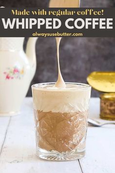 a spoon pouring coffee into a glass cup with whipped cream on top and the words made with regular coffee